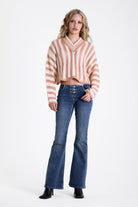 Pink and white stripe open knit v-neck jumper, worn by model
