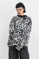Black and white dalmatian print oversized fuzzy knit jumper, worn by model