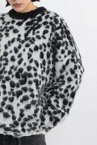 Black and white dalmatian print oversized fuzzy knit jumper, worn by model
