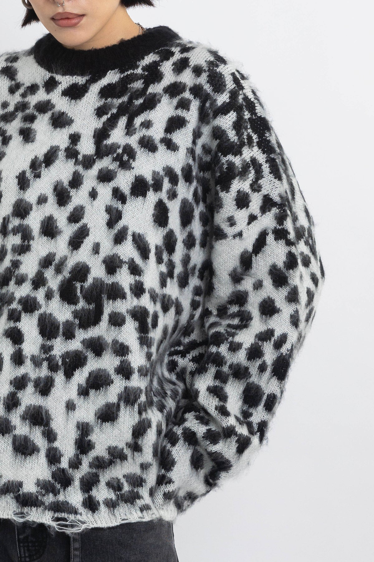 Black and white dalmatian print oversized fuzzy knit jumper, worn by model