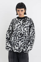 Black and white dalmatian print oversized fuzzy knit jumper, worn by model