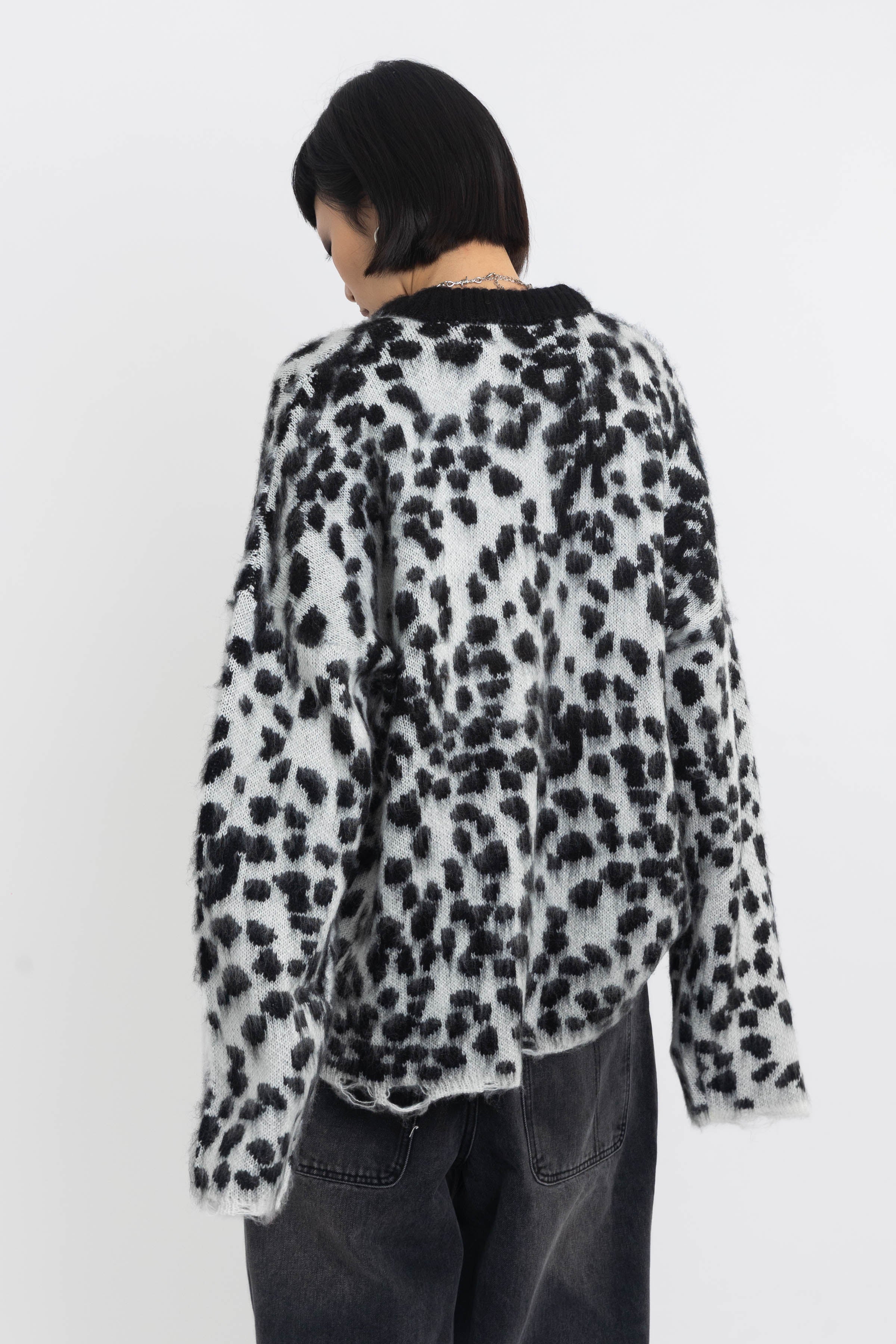 Black and white dalmatian print oversized fuzzy knit jumper, worn by model
