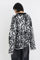 Black and white dalmatian print oversized fuzzy knit jumper, worn by model