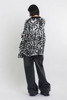 Black and white dalmatian print oversized fuzzy knit jumper, worn by model