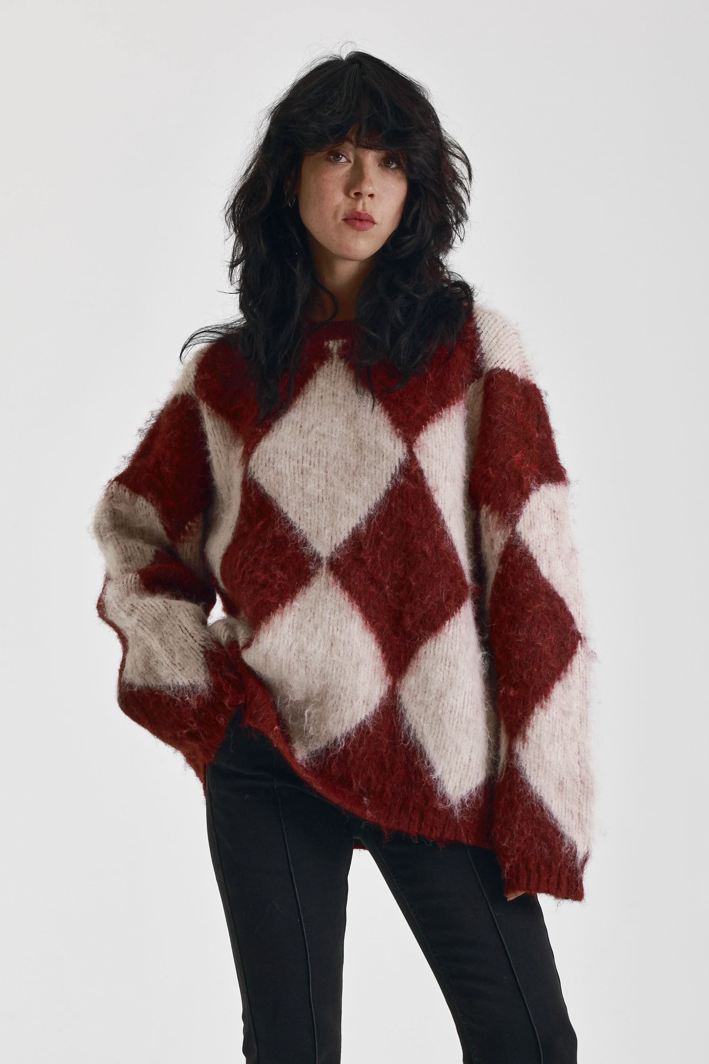 Burgundy and ecru argyle diamond check oversized knit jumper in brushed fluffy yarn, worn by model