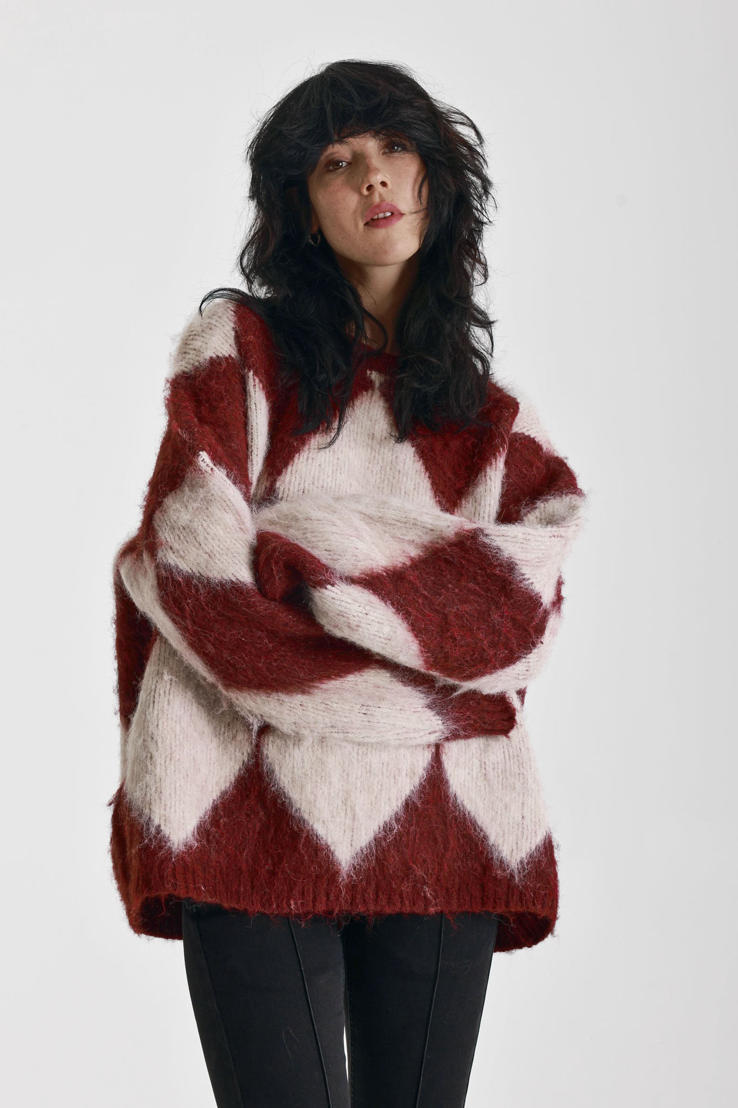 Burgundy and ecru argyle diamond check oversized knit jumper in brushed fluffy yarn, worn by model