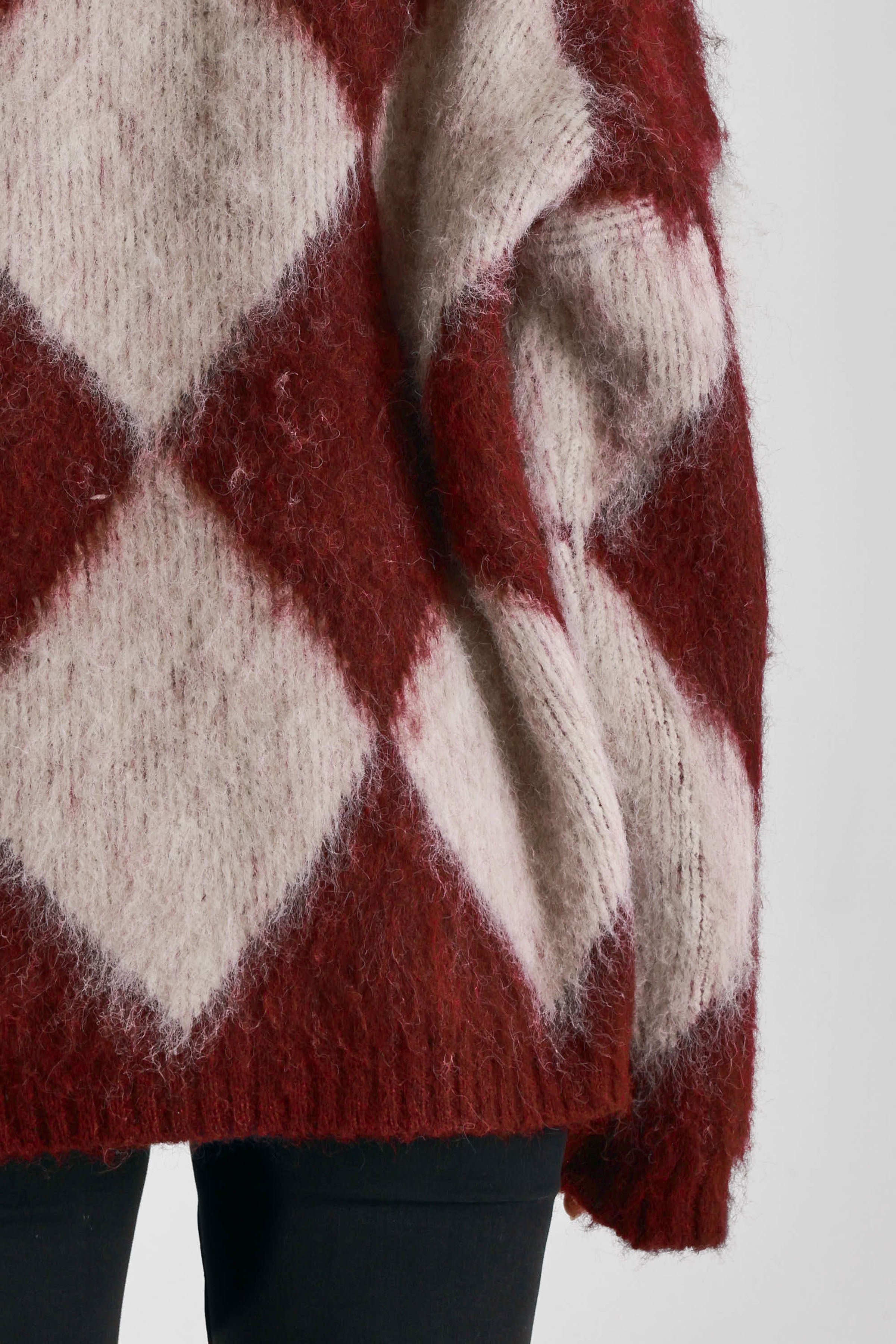 Burgundy and ecru argyle diamond check oversized knit jumper in brushed fluffy yarn, worn by model