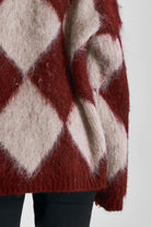 Burgundy and ecru argyle diamond check oversized knit jumper in brushed fluffy yarn, worn by model