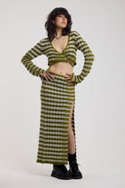 Green textured stripe knit maxi skirt with thigh high split and silver hardware detailing, worn as a co-ord by model