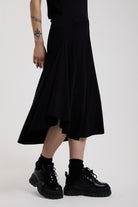 Black slinky midi maxi dress with cowl neck, draped open back, silver O-rings and strappy tie straps, worn by model