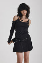 Washed black long-sleeve cold-shoulder mini dress with trigger clasp strap and eyelet belt, worn by model