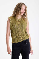 Acid wash green cable knit sweater vest, worn by model.