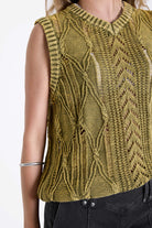 Acid wash green cable knit sweater vest, worn by model.