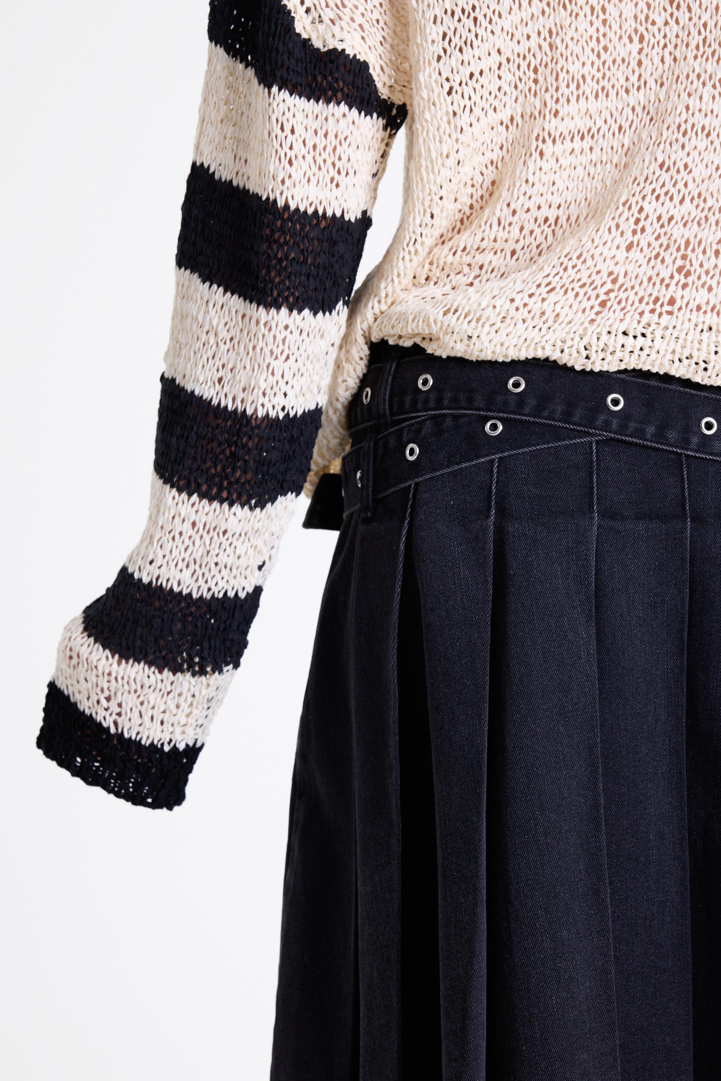 White relaxed open knit jumper with contrasting stripe sleeves, worn by model