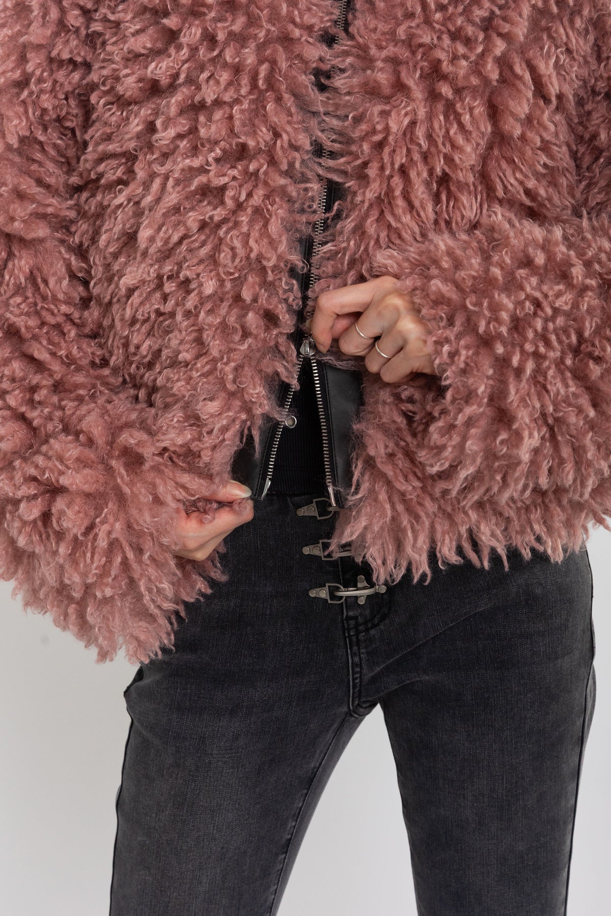 Dusty pink shaggy faux fur jacket with oversized collar and 2-way zip closure, worn by model