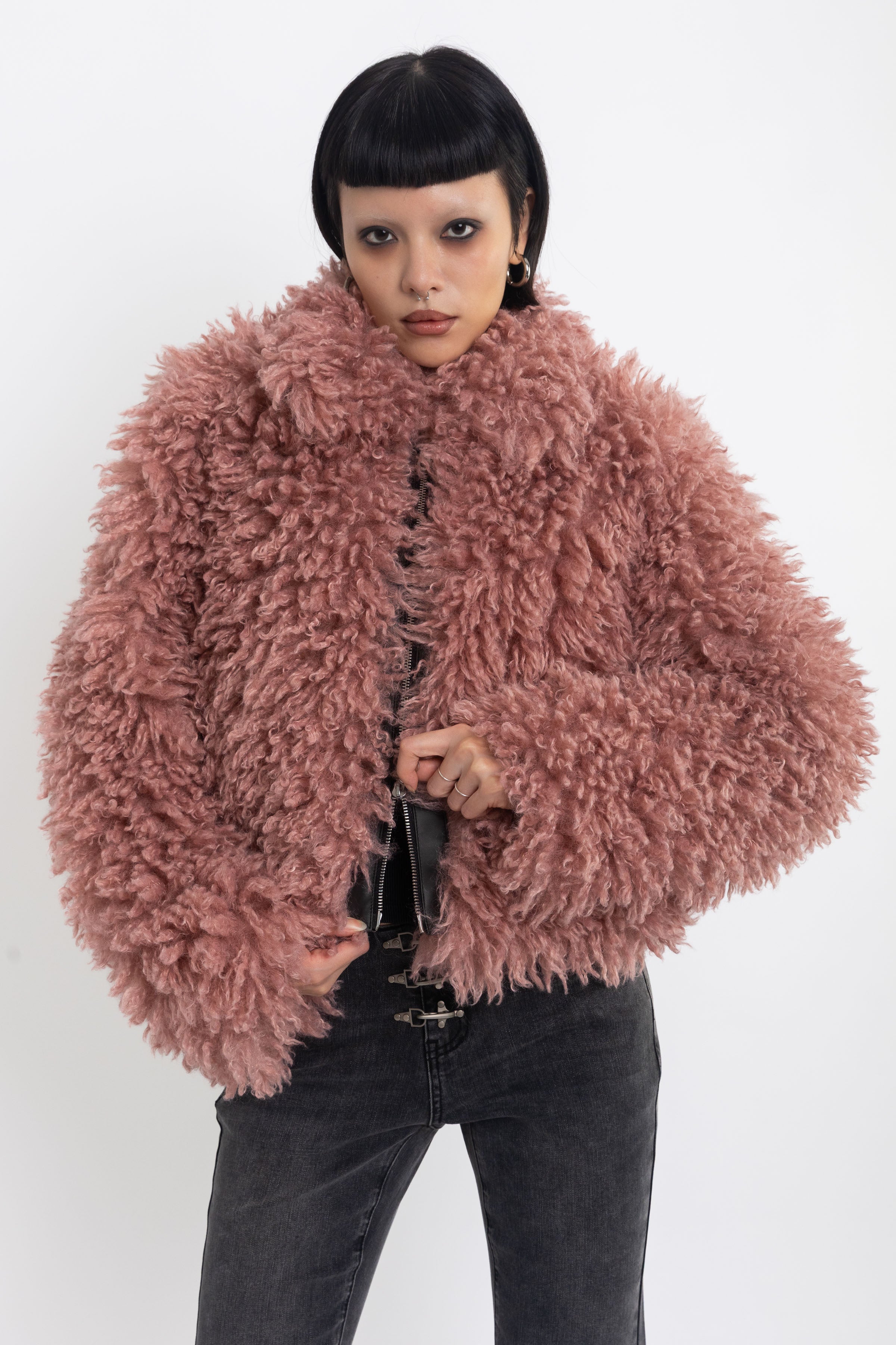 Dusty pink shaggy faux fur jacket with oversized collar and 2-way zip closure, worn by model