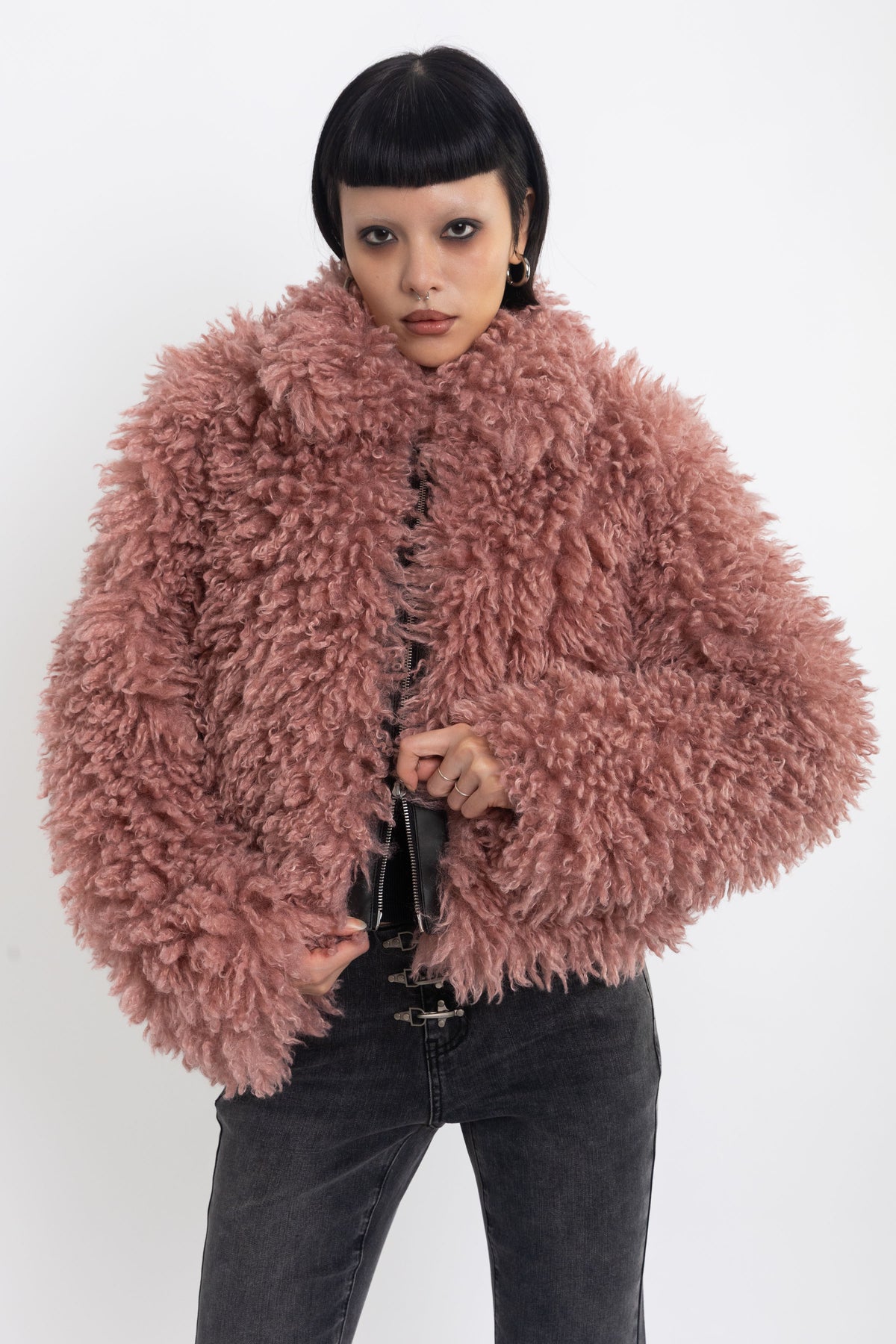Dusty pink shaggy faux fur jacket with oversized collar and 2-way zip closure, worn by model