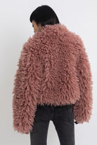 Dusty pink shaggy faux fur jacket with oversized collar and 2-way zip closure, worn by model