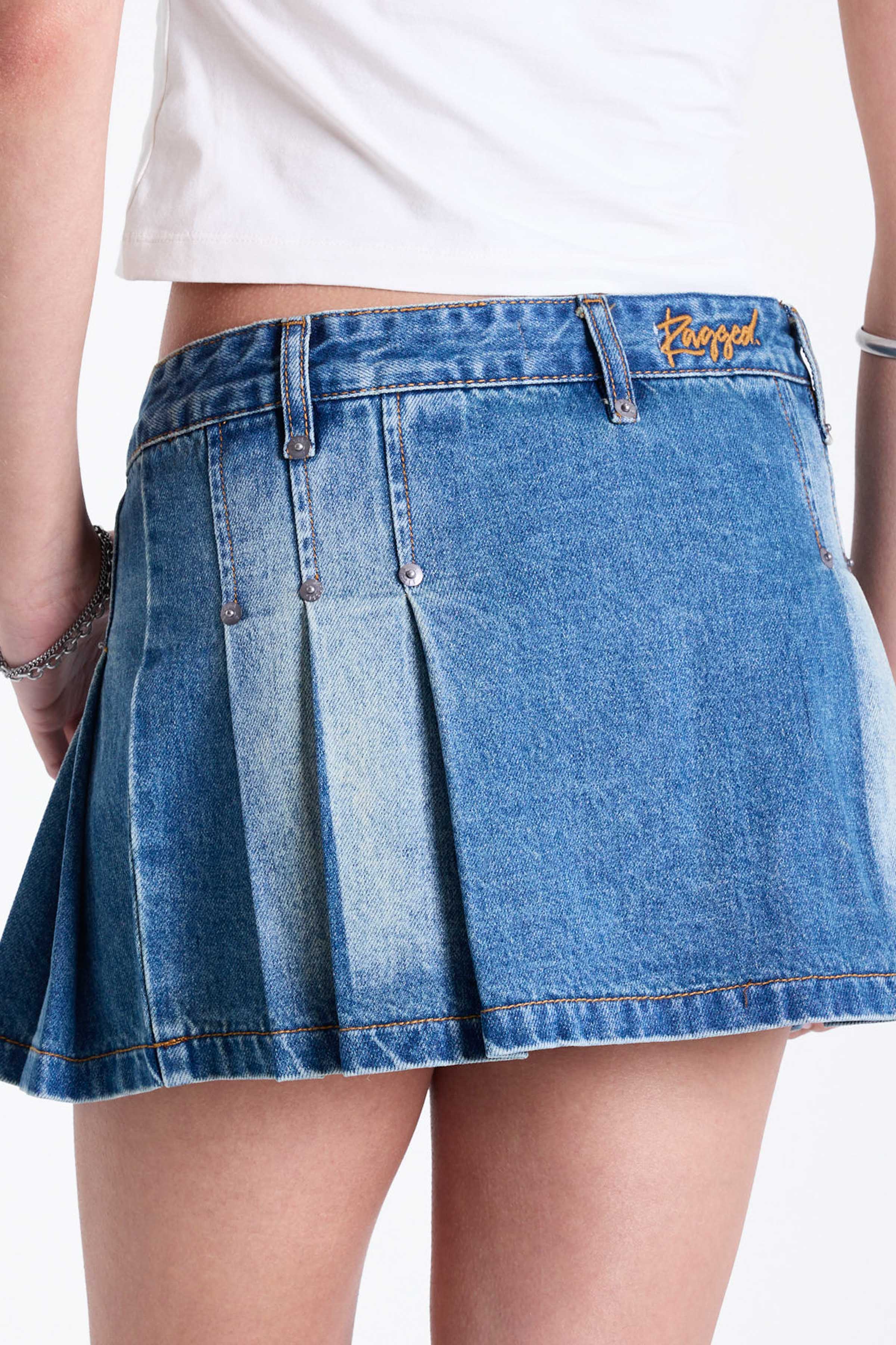 Vintage washed denim mini skirt with box pleats, worn by model.