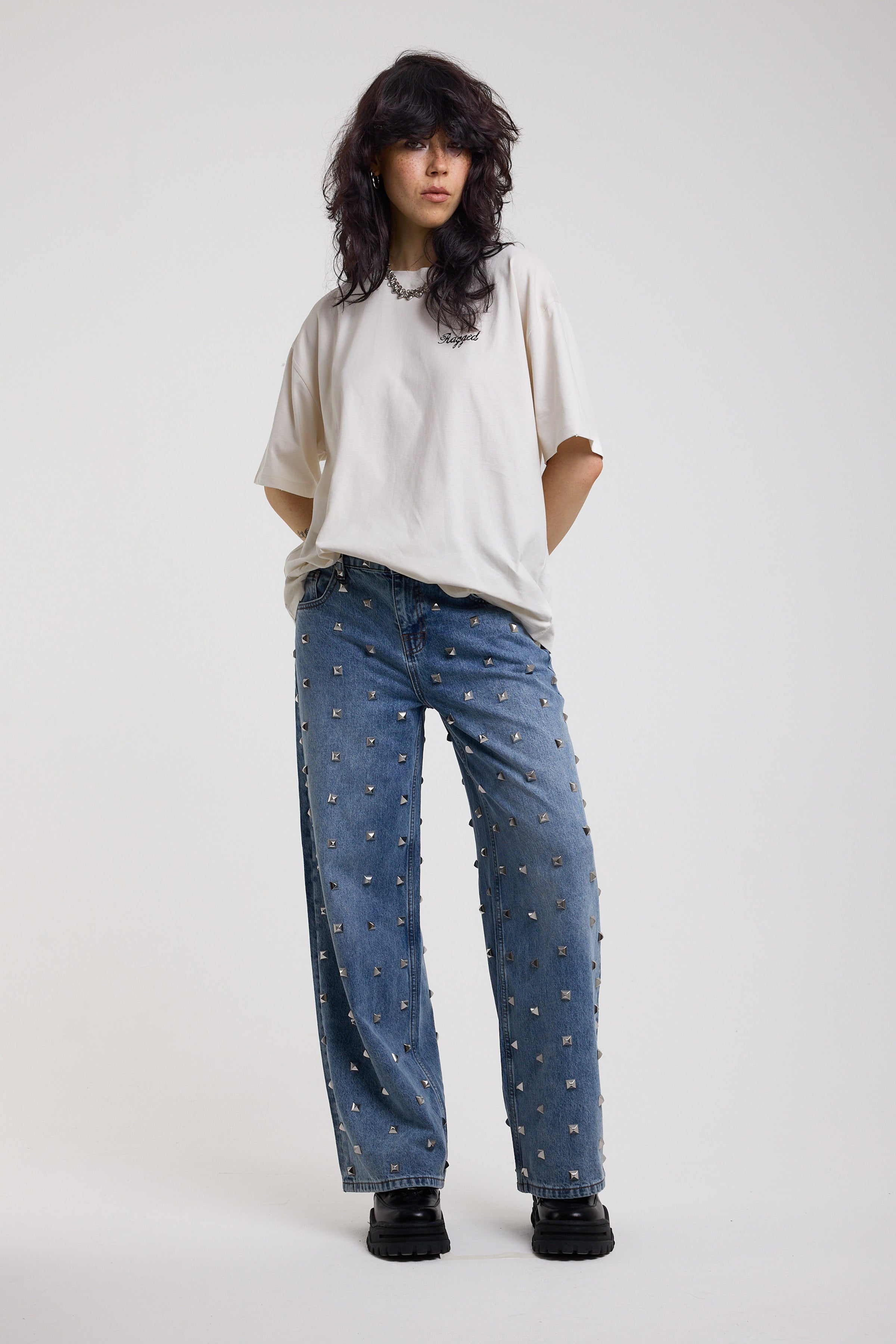 Ecru oversized t-shirt with Ragged logo, featuring a graphic heart motif on the back, worn by model