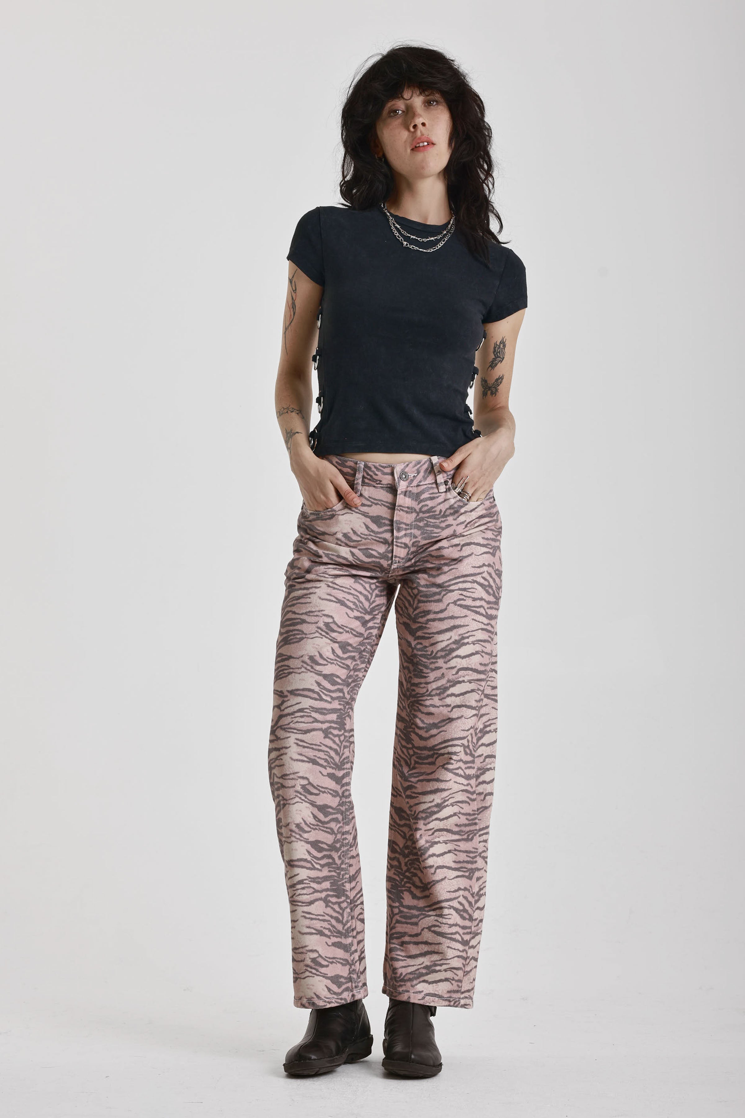 Brown tiger print relaxed straight leg jeans, worn by model