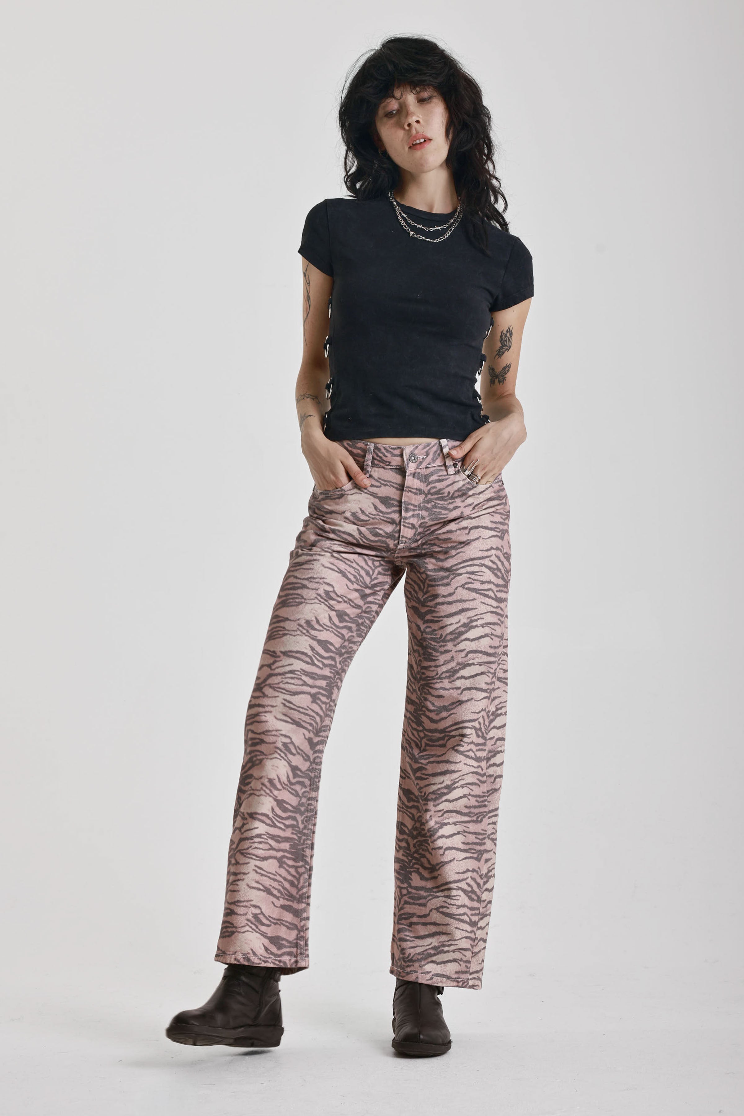 Brown tiger print relaxed straight leg jeans, worn by model