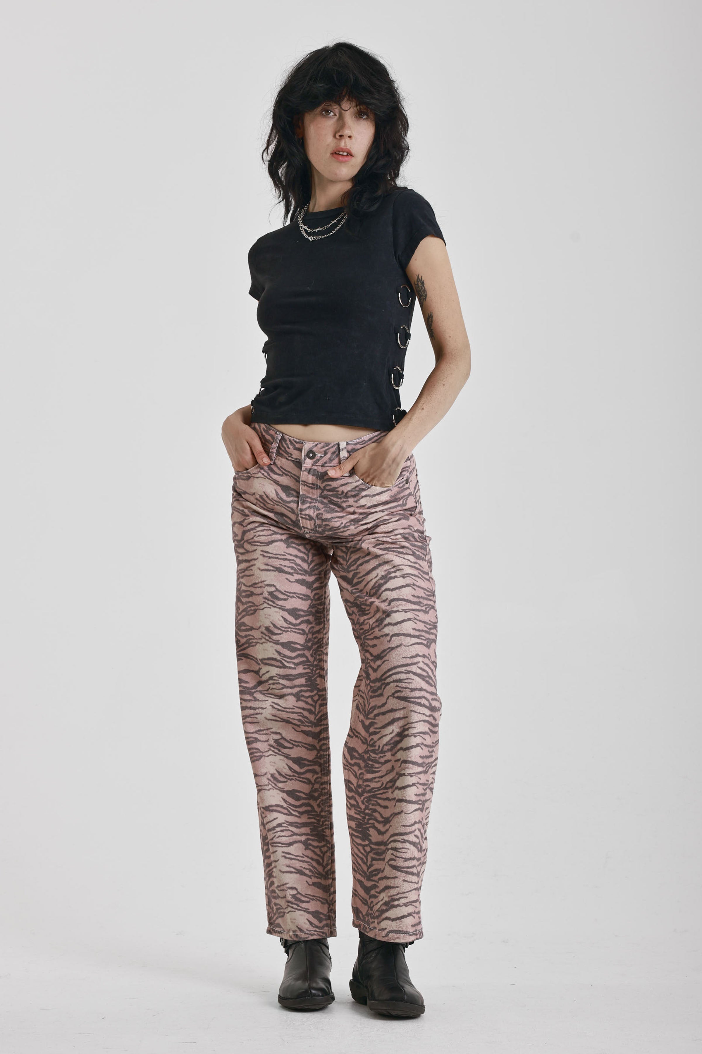 Brown tiger print relaxed straight leg jeans, worn by model