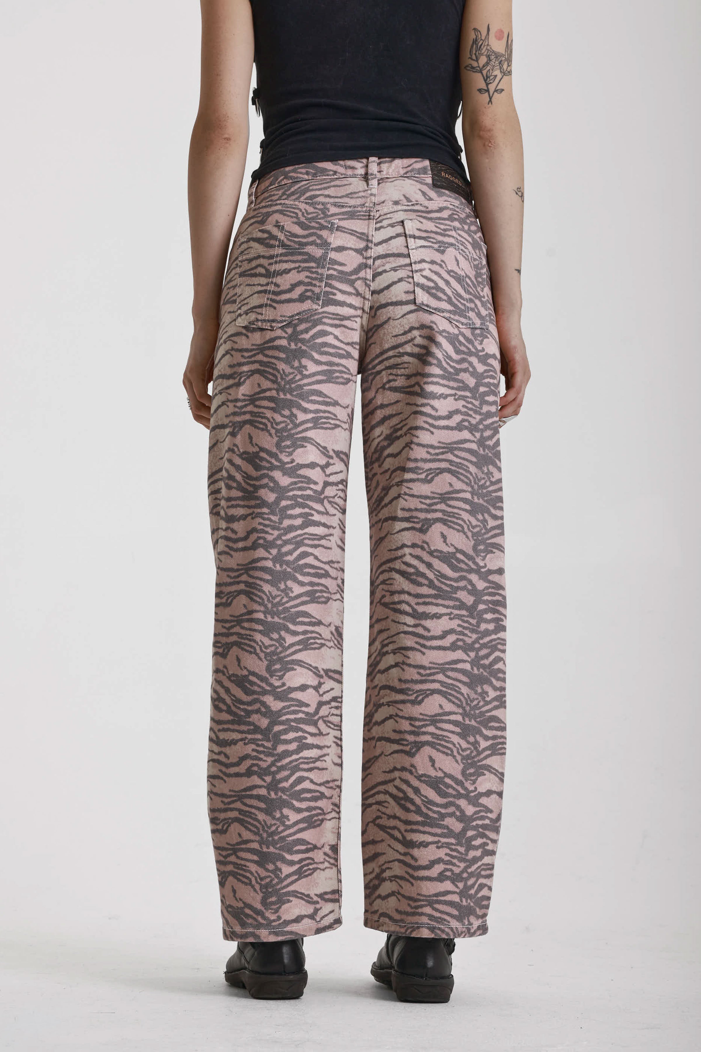 Brown tiger print relaxed straight leg jeans, worn by model