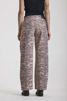 Brown tiger print relaxed straight leg jeans, worn by model