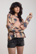 Pastel camo tie dye sheer knit jumper with open back and chain detail, worn by model