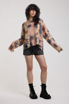 Pastel camo tie dye sheer knit jumper with open back and chain detail, worn by model