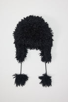 Black shaggy faux fur trapper hat with pom poms