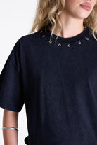 Acid wash black oversized t-shirt with silver eyelets and open back, worn by model