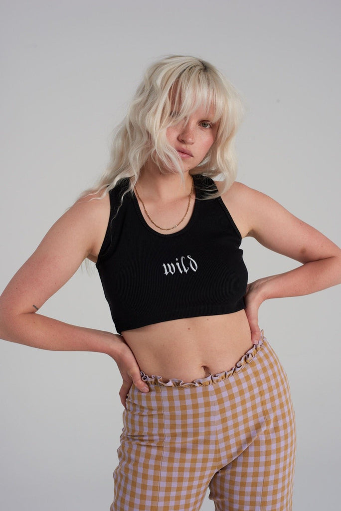 black cropped vest top with white embroidered word 